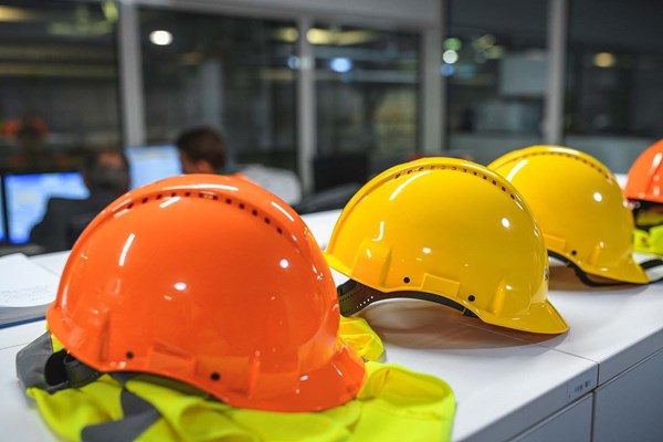 construction hardhats lined up on countertop