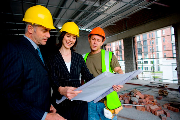 Construction workers checking building