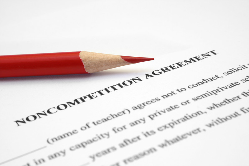 Noncompetition agreement with a red pencil on it