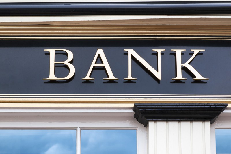 Globe on top of financial charts and graphs