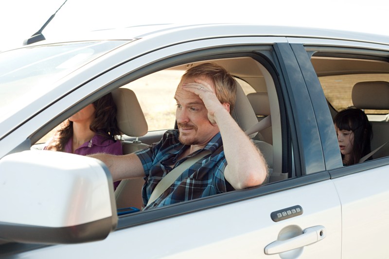 Frustrated man in white car
