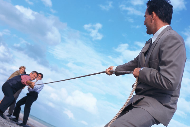 Business leader tug of war