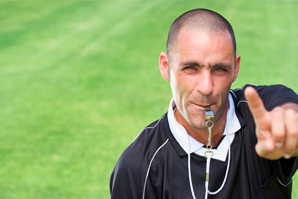 Coach blowing a whistle
