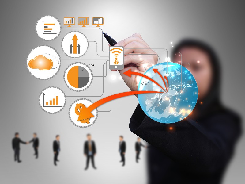 Businesswoman using stylus on transparent diagram of technology network