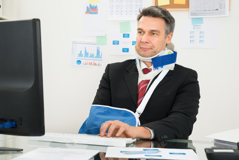 Older businessman with a broken arm