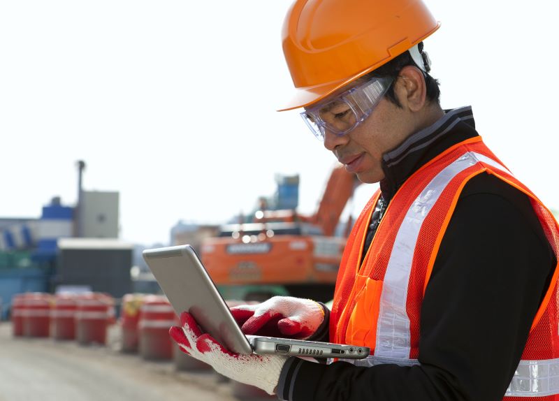 Construction worker using computer