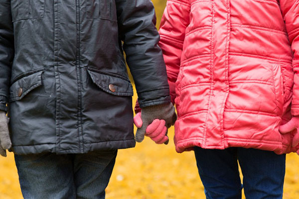 Boy and girl holding hands