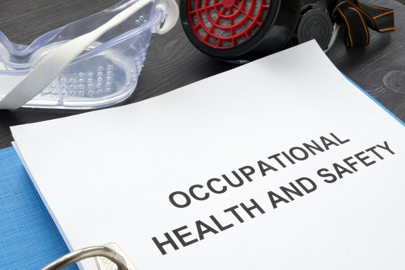 OSHA document and safety goggles