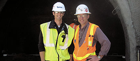 Andrew Leone and TJ Lyons, both wearing hard hats and safety vests