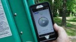 Hand holding an angle measuring ladder safety app on a smartphone