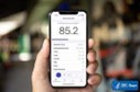 Hand holding a sound level meter app on a smartphone