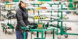 Worker cutting Unistrut with a safety shear