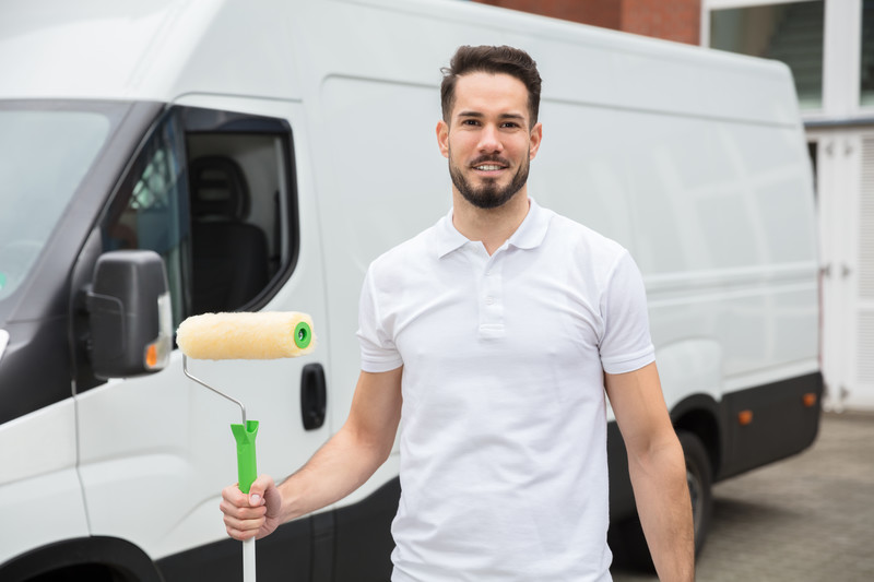 Contractor in front of van