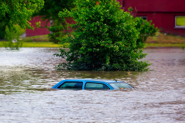car submerged in flood waters