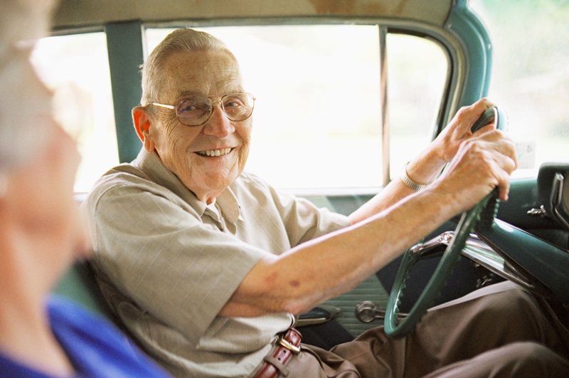 Senior citizen driving a car