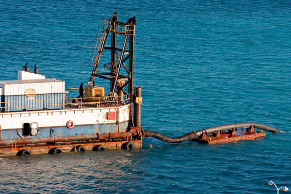 Boat cleaning up an oil spill