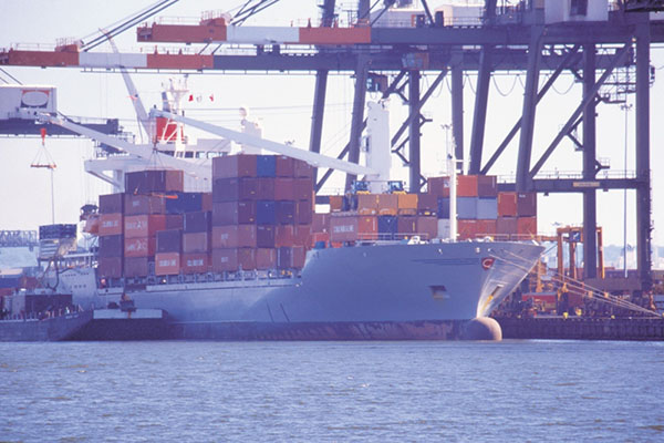Large cargo ship docked at a pier