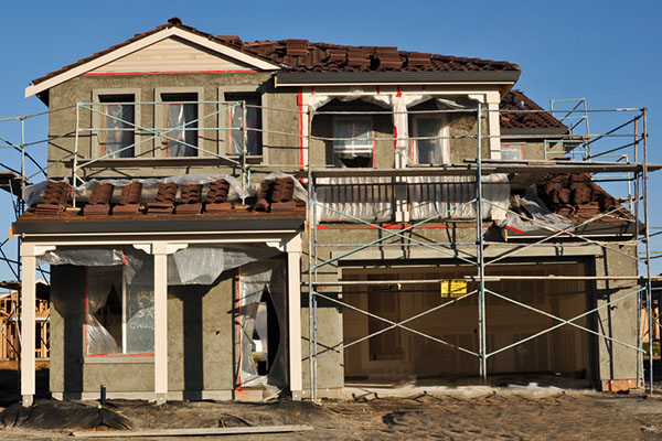 Construction scaffolding on the second story of a house