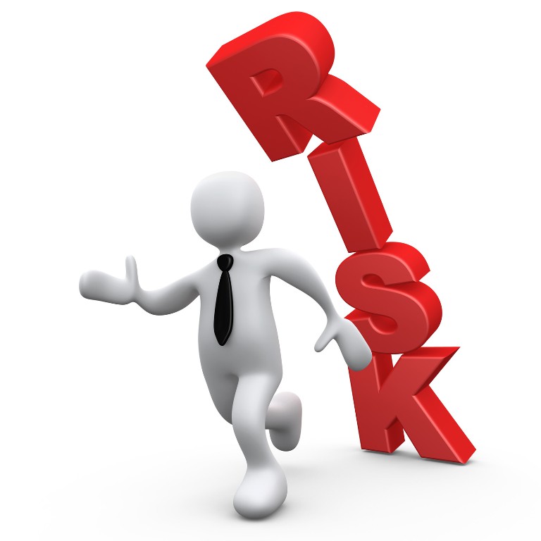 A whitecartoon man running from the words risk falling on him
