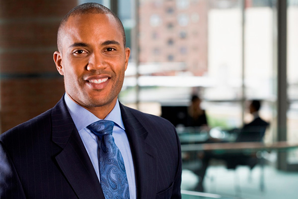 Businessman with coworkers in background