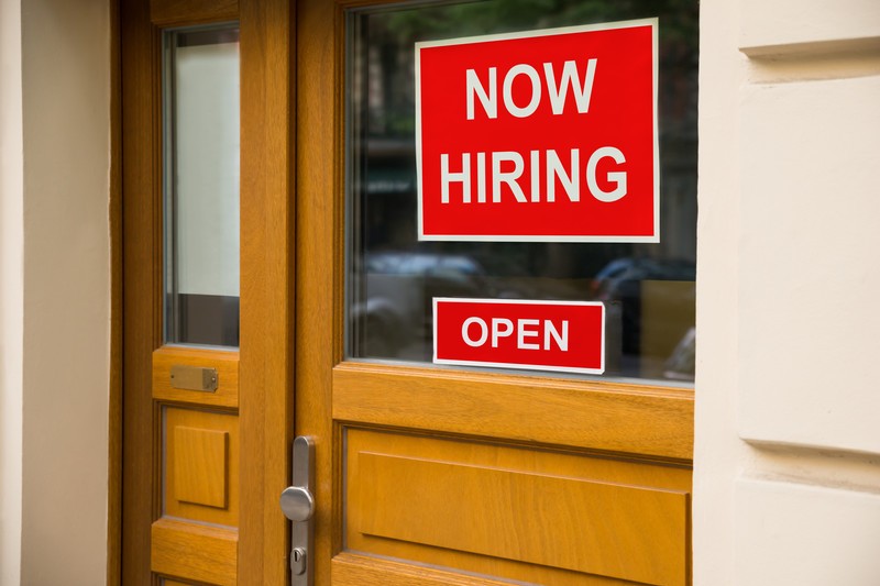 Now hiring sign on door