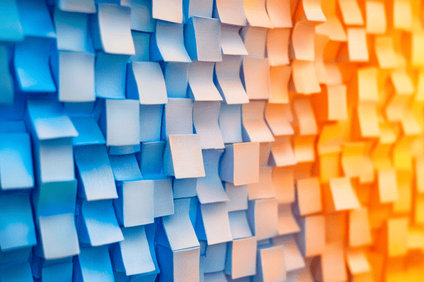 A wall of blocks shaded in a gradient from blue on the left to orange on the right