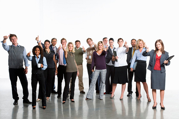 Group of professionals giving a thumbs up