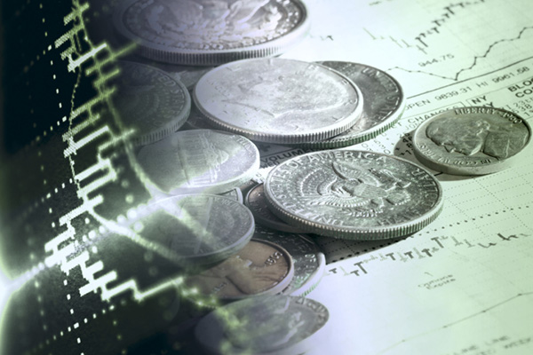Coins, financial paperwork, and graph
