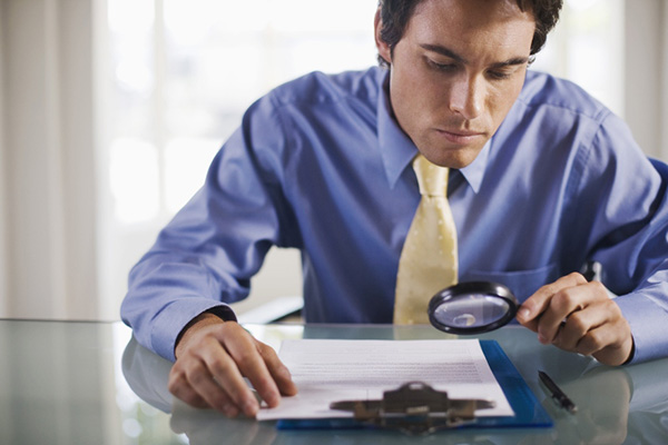 Businessman with a magnifying glass