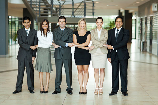 Businesspeople with locked arms
