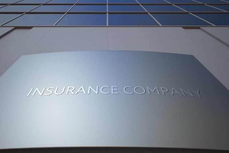 Insurance company on a sign on the outside of a building