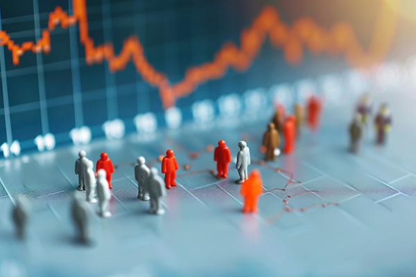 A downward graph with small, orange and gray figurines.