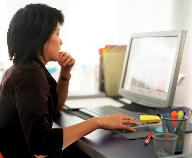 Woman focused on computer