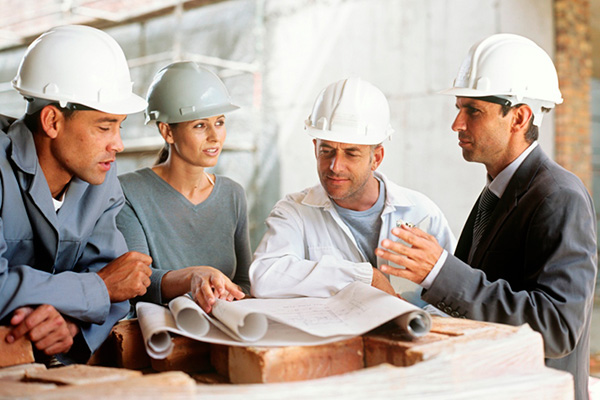 Group of architects looking at plans