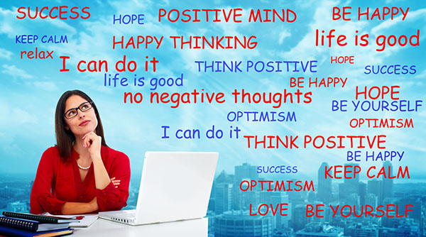 Businesswoman thinking positive thoughts