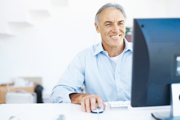 Older gentleman working at his desk