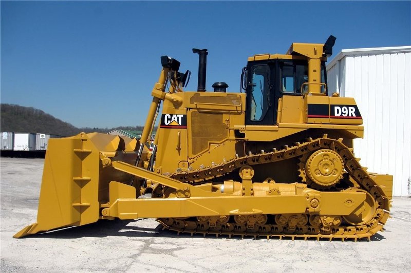 A yellow bulldozer working on a construction site