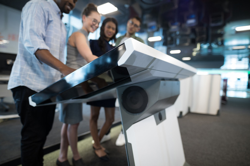 Business people using a touch-screen desk