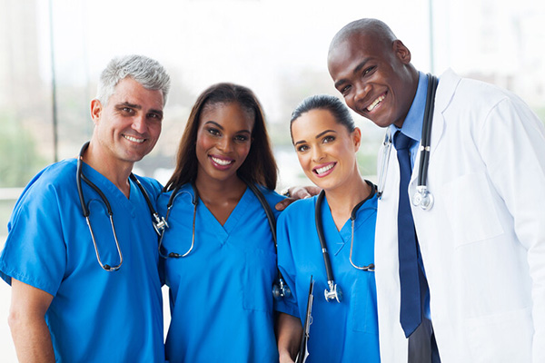 Smiling nurses and a doctor