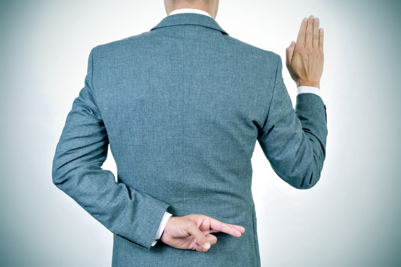 Fingers crossed swearing oath
