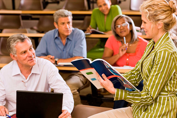 Teacher instructing an adult class