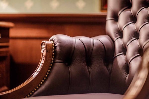 Brown Leather Wingback Chair in CEO Office