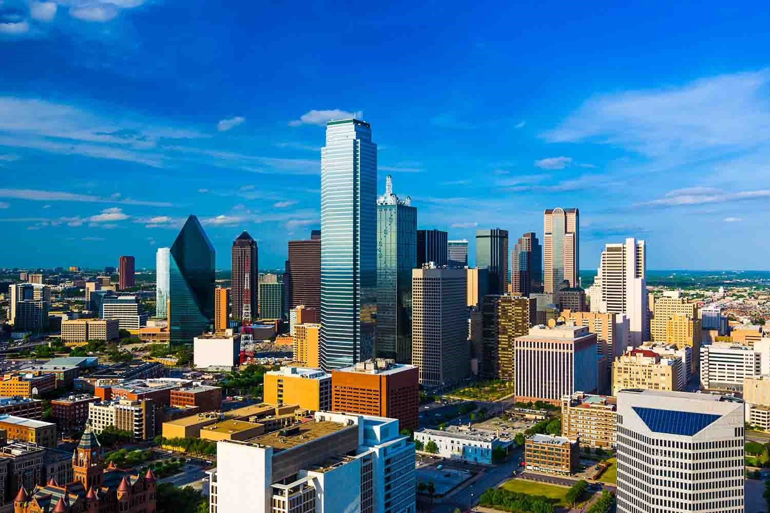 Downtown Dallas skyline view with a blue sky and a nice cloudscape.