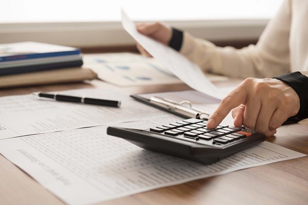 Financial analyst reviewing the books