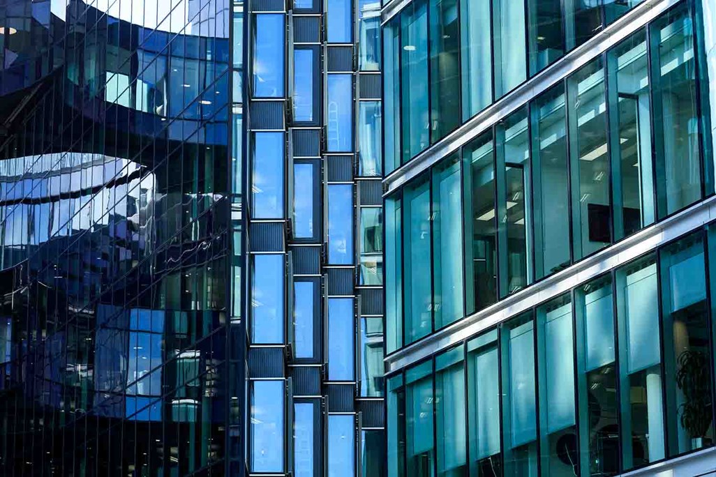 Modern Day Office Building with repeating geometric pattern of rectangle glass windows