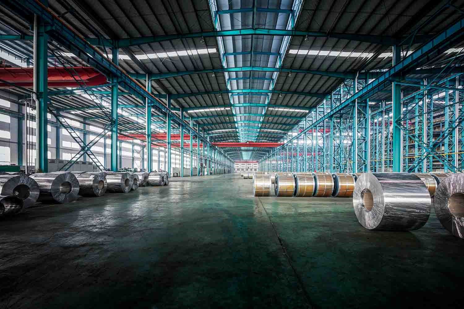 Packed Coils of Steel in a Manufacturing Factory Warehouse