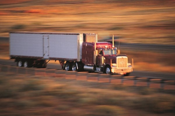 truck on highway with blurry background