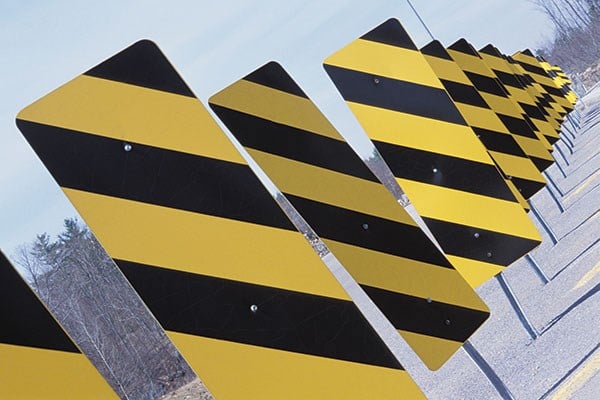 yellow and black road marker warning signs
