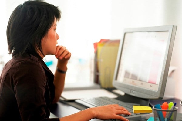 Woman focused on computer