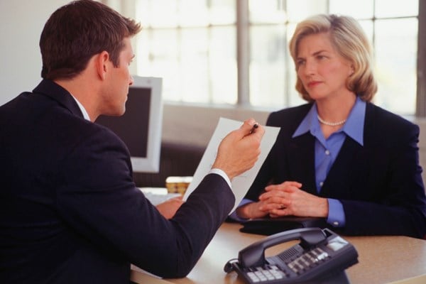 businessman and businesswoman having professional conversation